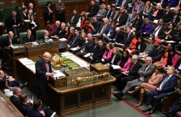 A handout photograph released by the UK Parliament shows Britain's Prime Minister Boris Johnson appearing in the House of Commons in central London on January 22, 2020, during the Prime Minister's Questions (PMQ) session. (Photo by JESSICA TAYLOR / various sources / AFP) / 