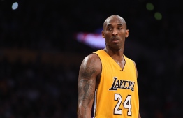 (FILES) In this file photo taken on November 21, 2015 Kobe Bryant (24) of the Los Angeles Lakers looks on during the Lakers NBA match up with the Toronto Raptors,at Staples Center in Los Angeles, California. - According to multiple US media sources,  Kobe Bryant died in a helicopter crash in Calabasas, California on January 26, 2020. (Photo by Robyn BECK / AFP)