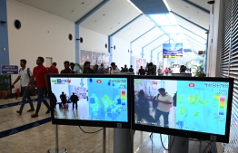 Arriving passengers are seen on screens of a thermal scanner, to check the body temperature, at Bandaranaike International Airport on January 24, 2020, following the coronavirus outbreak in China.  (Photo by LAKRUWAN WANNIARACHCHI / AFP)