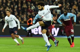 Liverpool's Egyptian midfielder Mohamed Salah scores the opening goal from the penalty spot during the English Premier League football match between West Ham United and Liverpool at The London Stadium, in east London on January 29, 2020. (Photo by Glyn KIRK / AFP) / RESTRICTED TO EDITORIAL USE. No use with unauthorized audio, video, data, fixture lists, club/league logos or 'live' services. Online in-match use limited to 120 images. An additional 40 images may be used in extra time. No video emulation. Social media in-match use limited to 120 images. An additional 40 images may be used in extra time. No use in betting publications, games or single club/league/player publications. / 
