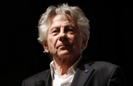 (FILES) In this file photo taken on November 04, 2019 French Polish director Roman Polanski looks on on stage after the preview of his last movie "J'accuse" (An Officer and a Spy) in Paris. (Photo by Thomas SAMSON / AFP)