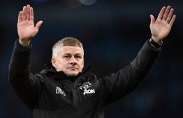 Manchester United's Norwegian manager Ole Gunnar Solskjaer applauds the fans following the English League Cup semi-final second leg football match between Manchester City and Manchester United at the Etihad Stadium in Manchester, north west England, on January 29, 2020. - Manchester City booked their place in a third successive League Cup final, but made hard work of disposing of Manchester United 3-2 on aggregate after losing the second leg of their semi-final 1-0 at home on Wednesday. (Photo by Oli SCARFF / AFP) / RESTRICTED TO EDITORIAL USE. No use with unauthorized audio, video, data, fixture lists, club/league logos or 'live' services. Online in-match use limited to 120 images. An additional 40 images may be used in extra time. No video emulation. Social media in-match use limited to 120 images. An additional 40 images may be used in extra time. No use in betting publications, games or single club/league/player publications. / 