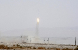 The launching of the Safir, or Ambassador, satellite carrier, which carries Iran's Rasad, or Observation, satellite into earth orbit, in an undisclosed location in 2011. (PHOTO: AP/Iranian Defense Ministry, Vahid Reza Alaei)