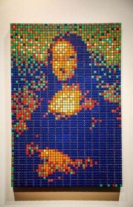 The street art Rubik's Cube version of the "Mona Lisa" entitled "Rubik Mona Lisa" made in 2005 by French artist Invader is on display at the Artcurial auction house in Paris on February 3, 2020 before being auctioned next February 23rd. - Made from 330 Rubik's Cubes by the French artist Invader, famous for his ceramic Space Invaders figures inspired by the vintage pixelated video game, the "Rubik Mona Lisa" is expected to sell for up to 150,000 euros ($166,000) when it goes under the hammer as a part of auction featuring some of the biggest names in street art. (Photo by FRANCOIS GUILLOT / AFP) /
