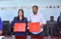 Minister of Education and SJ Constructions Director at the signing ceremony of handing over Dharumvantha School's new building project. PHOTO: EDUCATION MINISTRY