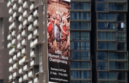 A promotional banner for the upcoming HSBC Women's World Championship, which was cancelled due to concerns about the novel coronavirus, is displayed in the financial district in Singapore on February 10, 2020. - Golf's HSBC Women's World Championship in Singapore later this month was cancelled on February 10 as was next week's LPGA Thailand tournament, meaning the US women's Tour has now lost all three of their lucrative early-season events in Asia. (Photo by Roslan RAHMAN / AFP)
