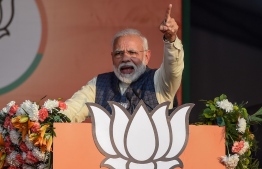 In this photo taken on February 3, 2020, India's Prime Minister and Bharatiya Janata Party (BJP) leader Narendra Modi gestures as he speaks during a rally for the upcoming Delhi state elections in New Delhi. - A diminutive former tax inspector is in the cross-hairs of Indian Prime Minister Narendra Modi's ruling party as it battles to take back power in Delhi's legislative elections on January 8. (Photo by Money SHARMA / AFP)