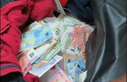 A sum of foreign currency confiscated by customs. PHOTO: CUSTOMS