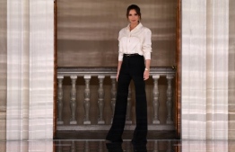 British fashion designer Victoria Beckham reacts after presenting creations for her Autumn/Winter 2020 collection on the third day of London Fashion Week in London on February 16, 2020. (Photo by DANIEL LEAL-OLIVAS / AFP)