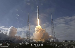 This video still image provided by SpaceX shows a SpaceX Falcon 9 rocket as it lifts off to launch 60 new Starlink satellites into orbit from Cape Canaveral Air Force Station, Florida on February 17, 2020. - SpaceX successfully launched its latest cluster of high-speed internet satellites into orbit February 17, 2020 but was unable to land its rocket booster on an autonomous ship, missing a key milestone. The private company founded by billionaire Elon Musk has revolutionized spaceflight in recent years by developing rockets capable of delivering their payload in space then flying back to Earth and landing upright on a target zone, ready to be-reused.It has successfully landed its booster 49 times previously and Monday's mission would have been the 50th. (Photo by Handout / SPACEX / AFP) / 