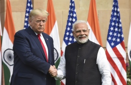 India's Prime Minister Narendra Modi (R) shakes hands with US President Donald Trump before a meeting at Hyderabad House in New Delhi on February 25, 2020. (Photo by Prakash SINGH / AFP)