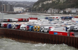 Lorries are parked at the port of Dover on February 20, 2020. (Photo by Adrian DENNIS / AFP)
