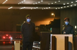 Private security guards wear protective facemasks at the main entrance  of the Aga Khan University Hospital where a patient of the COVID-19 novel coronavirus has been admitted in Karachi on February 26, 2020. - Pakistan has detected its first two cases of novel coronavirus, a public health advisor to the prime minister tweeted on February 26, days after Islamabad closed its land border with Iran, where 19 people have died from the virus. PHOTO: ASIF HASSAN / AFP