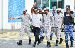 Former President Abdulla Yameen being escorted by security forces during the money laundering case trials.