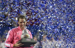 Spain's Rafael Nadal Rafael Nadal holds the trophy after winning the Mexican Tennis Open ATP final match against USA's Taylor Fritz during the Mexico ATP Open men's singles tennis final in Acapulco, Guerrero state on February 29, 2020. PHOTO:  PEDRO PARDO / AFP