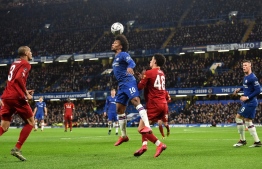 Chelsea's Brazilian midfielder Willian (centre L) vies with Liverpool's English midfielder Curtis Jones to header the ball during the English FA Cup fifth round football match between Chelsea and Liverpool at Stamford Bridge in London on March 3, 2020. (Photo by Glyn KIRK / AFP) / RESTRICTED TO EDITORIAL USE. No use with unauthorized audio, video, data, fixture lists, club/league logos or 'live' services. Online in-match use limited to 120 images. An additional 40 images may be used in extra time. No video emulation. Social media in-match use limited to 120 images. An additional 40 images may be used in extra time. No use in betting publications, games or single club/league/player publications. / 