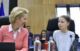 President European Commission President Ursula von der Leyen (L) talks with Swedish environmentalist Greta Thunberg (R) before a college meeting at the EU headquarters in Brussels on March 4, 2020. (Photo by JOHN THYS / AFP)