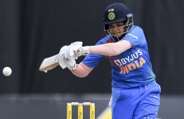 (FILES) In this file photo taken on February 12, 2020, India's Shafali Verma bats during a cricket match against Australia in Melbourne. - India's 16-year-old women's cricket sensation Shafali Verma zoomed on March 4 to the top of ICC T20 batting rankings after several match winning performances at T20 World Cup in Australia. (Photo by William WEST / AFP) / 