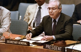 (FILES) In this file photo taken on August 08, 1988 UN Secretary General Javier Perez de Cuellar announces a cease-fire in the Iran-Iraq war will begin on August 20 during a special session of the UN Security Council, at UN headquarters in New York. - Perez de Cuellar died on March 4, 2020 Lima at the age of 100, his son reported. (Photo by Mark CARDWELL / AFP)