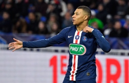Paris Saint-Germain's French forward Kylian Mbappe celebrates after scoring a goal during the French Cup semi-final football match between Olympique Lyonnais (OL) and Paris Saint-Germain (PSG) at the Groupama Stadium in Decines-Charpieu, central-eastern France, on March 4, 2020. PHOTO: PHILIPPE DESMAZES / AFP