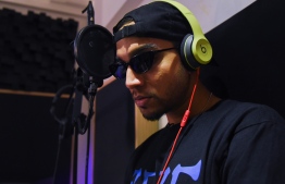 This picture taken on January 28, 2020 shows rapper Yung Raja recording in a studio in Singapore. - A growing number of artists from Singapore, Indonesia, Malaysia, Thailand and the Philippines have been snapped up by the label behind superstars from LL Cool J to Jay-Z and Rihanna. Def Jam is hoping to capitalise on a new wave of regional rap stars from the untapped Southeast Asian market where streaming platforms are flourishing. PHOTO: CATHERINE LAI / AFP