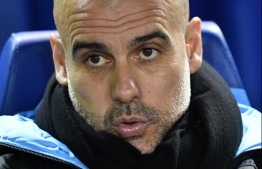 Manchester City's Spanish manager Pep Guardiola reacts ahead of the English FA Cup fifth round football match between Sheffield Wednesday and Manchester City at The Hillsborough Stadium in Sheffield, north east England on March 4, 2020. (Photo by Paul ELLIS / AFP) / RESTRICTED TO EDITORIAL USE. No use with unauthorized audio, video, data, fixture lists, club/league logos or 'live' services. Online in-match use limited to 120 images. An additional 40 images may be used in extra time. No video emulation. Social media in-match use limited to 120 images. An additional 40 images may be used in extra time. No use in betting publications, games or single club/league/player publications. / 