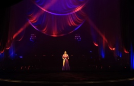 A hologram of legendary Egyptian singer Umm Kulthum is projected on stage at Cairo Opera House in Cairo, late on March 6, 2020, about 45 years after the singer's death. - A revered icon of Arab music, Umm Kulthum's career flourished from the 1920s until her death in 1975. PHOTO: KHALED DESOUKI / AFP