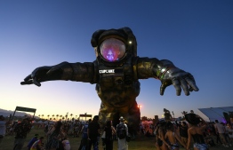 (FILES) In this file photo taken on April 12, 2019 "Overview Effect" Astronaut sculpture by Poetic Kinetics, founded by artist Patrick Shearn, is unleashed at Coachella Music Festival in Indio, California. - Organizers on March 10, 2020 rescheduled the Coachella music festival until October over coronavirus concerns, following advice from local health authorities. "While this decision comes at a time of universal uncertainty, we take the safety and health of our guests, staff and community very seriously," Goldenvoice, the company that puts on the event, said in a statement. PHOTO: VALERIE MACON / AFP