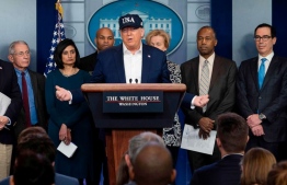 President Donald Trump gives a press briefing about the coronavirus (COVID-19) alongside members of the Coronavirus Task Force in the Brady Press Briefing Room at the White House, in Washington, March 14, 2020. PHOTO: GETTY IMAGES