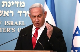 Israeli Prime Minister Benjamin Netanyahu delivers an speech at his Jerusalem office on March 14, 2020, regarding the new measures that will be taken to fight the Corona virus in Israel. - Netanyahu said Israel would shut down eateries, shopping centres and gyms in a bid to halt the spread of coronavirus. Netanyahu also said he would ask the government's approval in the upcoming cabinet meeting set to be held via video conference to allow "technologies used in the war against terror" to be used to track the movements of Israelis with coronavirus. (Photo by GALI TIBBON /  / AFP)