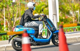 Malé, March 19, 2020: A man wears a face mask as he drives away on his motorcycle on Sinamale Bridge. Residents are increasingly using face masks to prevent the spread of COVID-19. PHOTO: AHMED AWSHAN ILYAS/MIHAARU