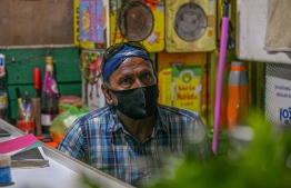 Malé, March 19, 2020: A shopkeeper pictured at the local market wearing a face mask as a preventive measure against the COVID-19. PHOTO: AHMED AWSHAN ILYAS/MIHAARU