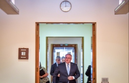 Australian Prime Minister Scott Morrison walks in a meeting with cabinet ministers and the Leader of the Opposition Labor Party Anthony Albanese at Parliament House in Canberra on March 22, 2020. (Photo by DAVID GRAY / AFP)