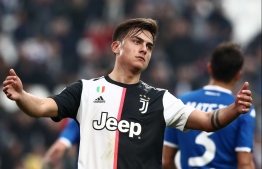 (FILES) In this file picture taken on February 16, 2020 Juventus' Argentine forward Paulo Dybala reacts during the Italian Serie A football match against Brescia at the Juventus stadium in Turin. - Argentina striker Paulo Dybala said on March 21, 2020 that he has become the third Juventus player to test positive for coronavirus. "Hi everyone. I just wanted to let you know that we have received the Covid-19 test results and that Oriana (Sabatini, his girlfriend) and I are positive," the 26-year-old tweeted. PHOTO: ISABELLA BONOTTO / AFP
