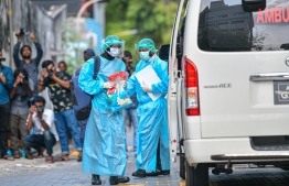 Health personnel in protective gear, collecting samples of a suspected patient in the COVID-19 drill held in preparation of the pandemic. PHOTO: MIHAARU