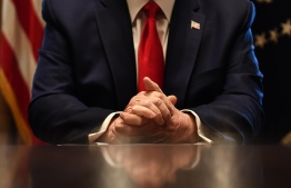 US President Donald Trump's hands are seen as he speaks to the press after a meeting with nursing industry representatives on the response to the novel coronavirus, COVID-19, at the White House in Washington, DC, on March 18, 2020.
BRENDAN SMIALOWSKI / AFP