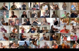 This handout image provided by the National Orchestra of France (Orchestre National de France) on March 31, 2020, shows an image grab from a video posted on the internet in which musicians of the National Orchestra of France are seen in split-screen as they perform Maurice Ravel's "Bolero", each from their home, during a strict lockdown in France aimed at curbing the spread of the COVID-19 pandemic. PHOTO: AFP