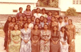 Fathimath Jameel, pictured in a group photo with the members of the women's committee on one of her visits to the islands. PHOTO: MIHAARU FILES