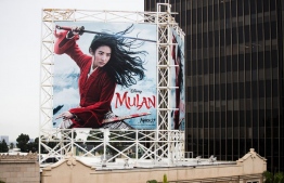 A billboard for Disney's "Mulan" in Hollywood on March 13. Photographer: Rich Fury/Getty Images