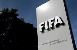 (FILES) In this file photo taken on October 3, 2013, the logo of the global football's governing body FIFA is seen  at its headquarters in Zurich. - FIFA on April 6, 2020, urged clubs and players to reach agreement on wage reductions to protect clubs suffering financial damage due to the coronavirus crisis, sources said. (Photo by Fabrice COFFRINI / AFP)