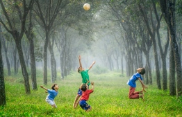 Children pictured playing with a ball. PHOTO: ROBERT COLLIN/UNSPLASH