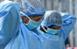 Doctors, nurses and other healthcare professionals suit up, during a training programme held concerning the critical care of patients found positive for COVID19. PHOTO: NISHAN ALI / MIHAARU