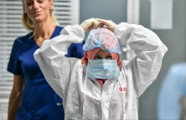 A frontline worker at Indira Gandhi Memorial Hospital donning her Personal Protective Equipment (PPE). PHOTO: MIHAARU