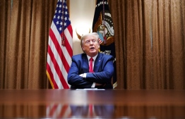 US President Donald Trump speaks during a meeting with healthcare executives in the Cabinet Room of the White House in Washington, DC on April 14, 2020. (Photo by MANDEL NGAN / AFP)
