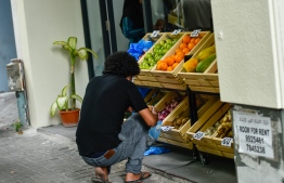 A shopper visiting an outlet amid the lockdown in the capital city of Male'. PHOTO: AHMED AWSHAN ILYAS/ MIHAARU