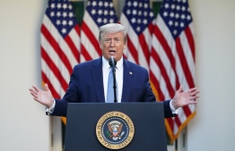 US President Donald Trump gestures as he speaks during the daily briefing on the novel coronavirus, which causes COVID-19, in the Rose Garden of the White House on April 15, 2020, in Washington, DC. PHOTO: AFP