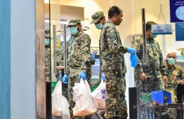 Military personnel helping in delivering goods purchased by the public to their respective households. PHOTO: MIHAARU