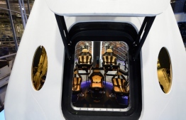(FILES) In this file photo taken on May 29, 2014, SpaceX's new seven-seat Dragon V2 spacecraft is seen at a press conference to unveil the new spaceship, in Hawthorne, California. - NASA announced on on April 17, 2020, that a SpaceX rocket will send two American astronauts to the International Space Station in May, the first manned US spaceflight in nearly a decade. "On May 27, @NASA will once again launch American astronauts on American rockets from American soil!" NASA chief Jim Bridenstine said in a tweet. (Photo by Robyn BECK / AFP)