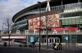 (FILES) In this file photo taken on March 13, 2020 A general view is pictured of the Emirates Stadium in London on March 13, 2020. - Arsenal's executive team have agreed to cut more than a third of their salary as the club warned it is facing "one of the most challenging periods" in its history on April 15, 2020. The Premier League has been suspended indefinitely due to strict government guidelines to control the spread of coronavirus. (Photo by Isabel Infantes / AFP)