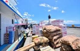 Imported cargo being loaded onto a boat. PHOTO: AHMED AWSHAN ILYAS/ MIHAARU